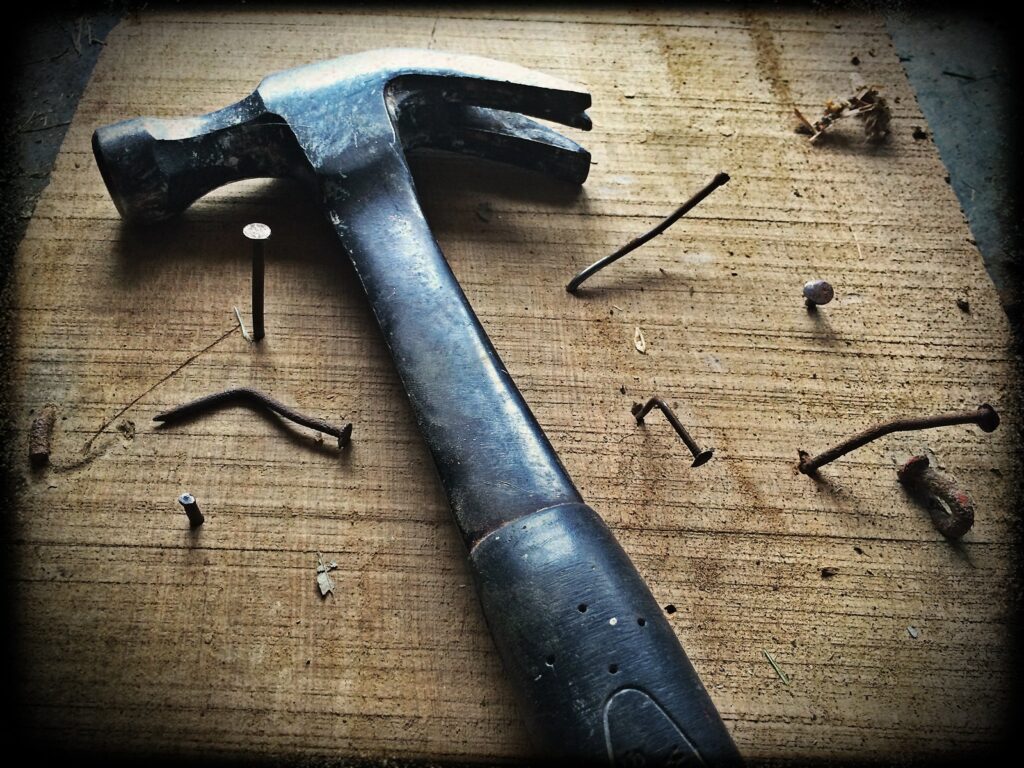 hammer with nails for DIY craft
