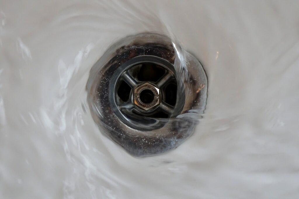 Water swirling around drain